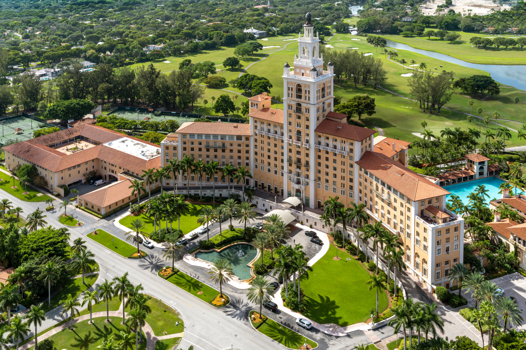 The Biltmore Hotel tower over the palms and fairways of Coral Gables, Florida.